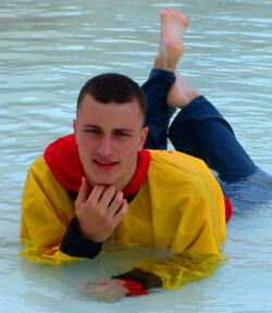 pool lifeguard swimming in uniform clothes